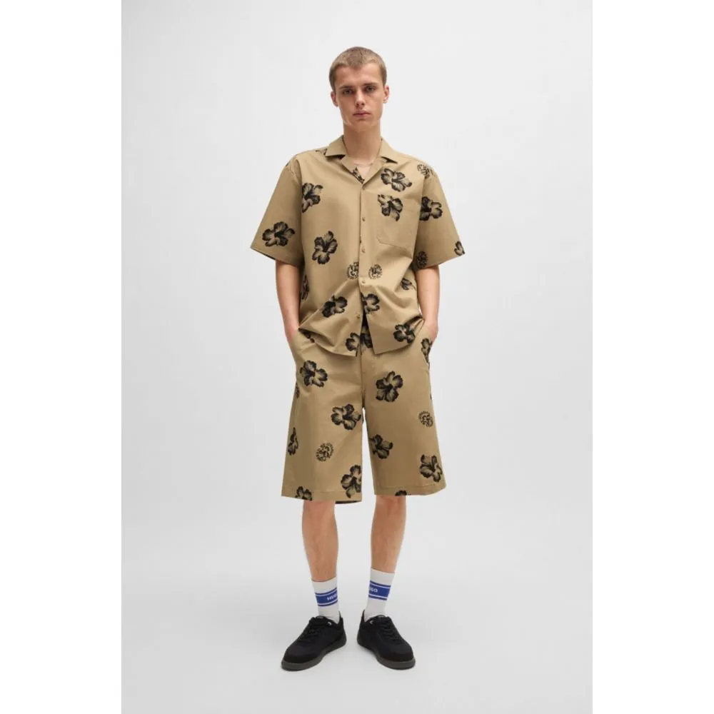 Baggy-fit shorts in hibiscus-print stretch-cotton twill