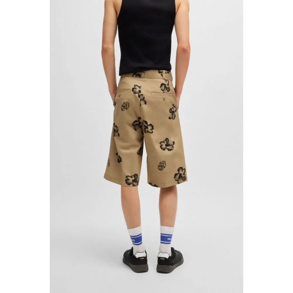 Baggy-fit shorts in hibiscus-print stretch-cotton twill