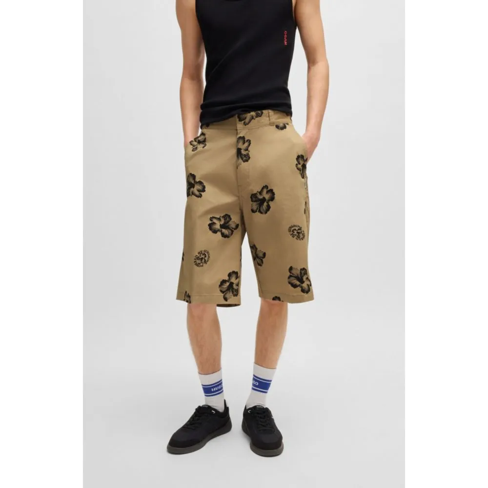 Baggy-fit shorts in hibiscus-print stretch-cotton twill