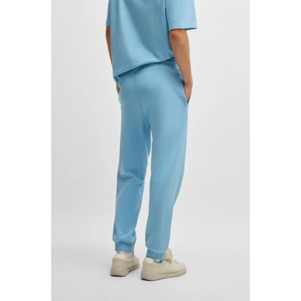 Cotton-terry tracksuit bottoms with Happy HUGO logo patch