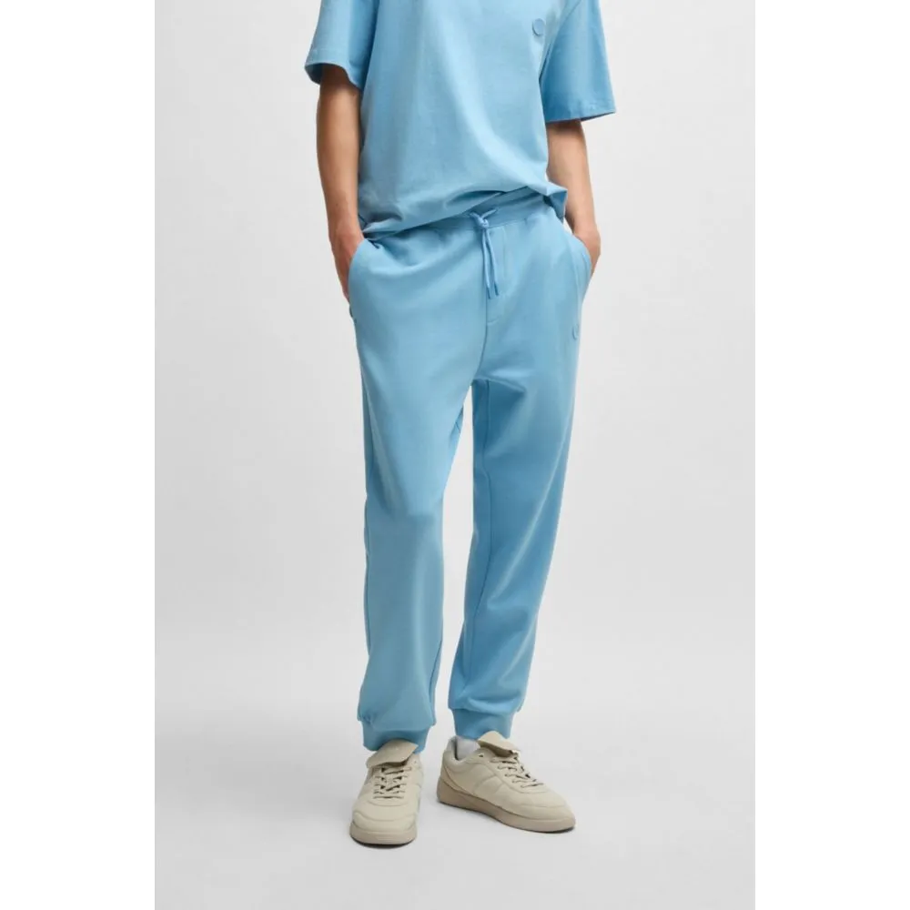 Cotton-terry tracksuit bottoms with Happy HUGO logo patch