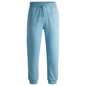 Cotton-terry tracksuit bottoms with Happy HUGO logo patch