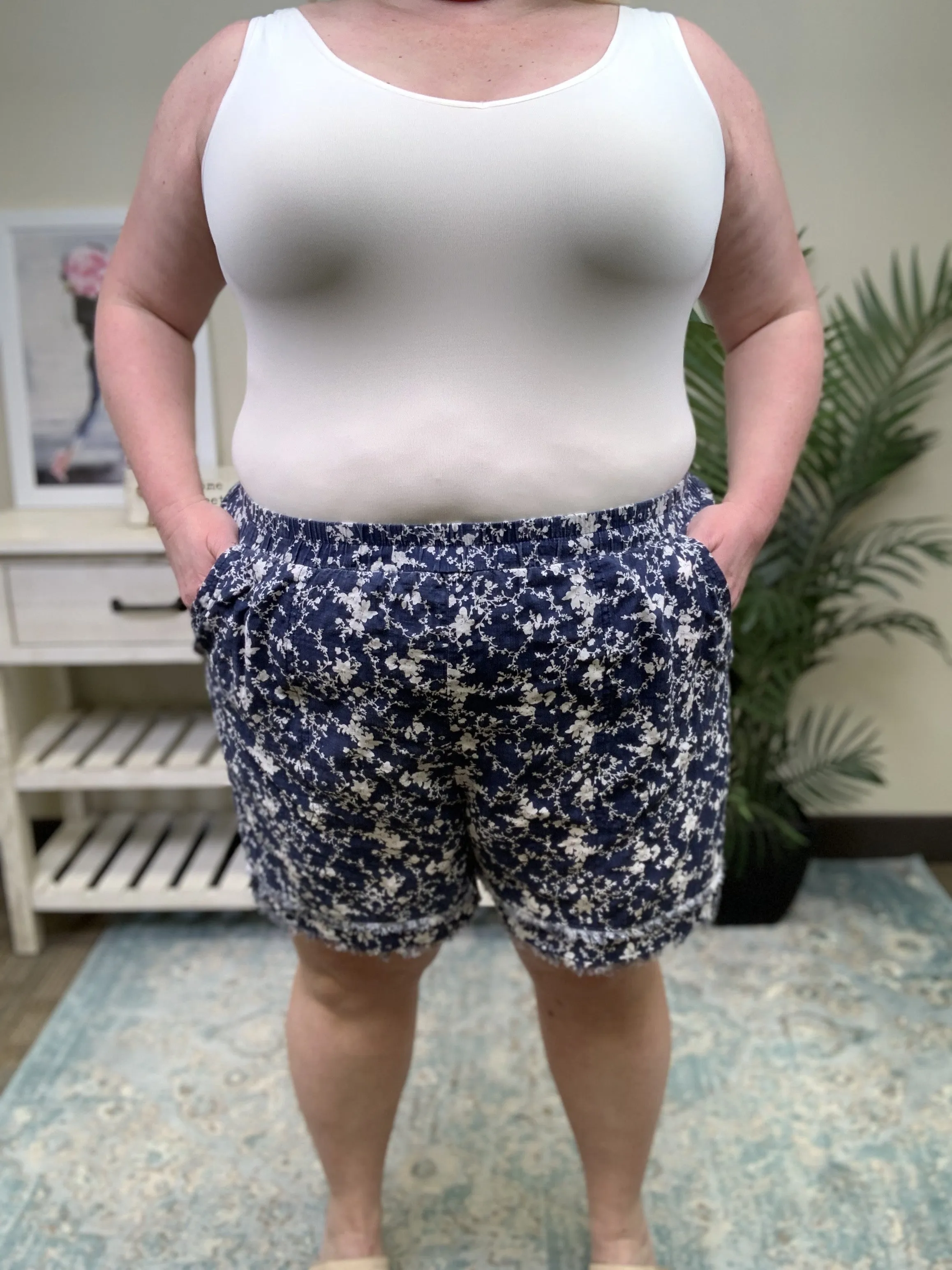 Keep Me Guessing Women's Floral Frayed Hem Shorts