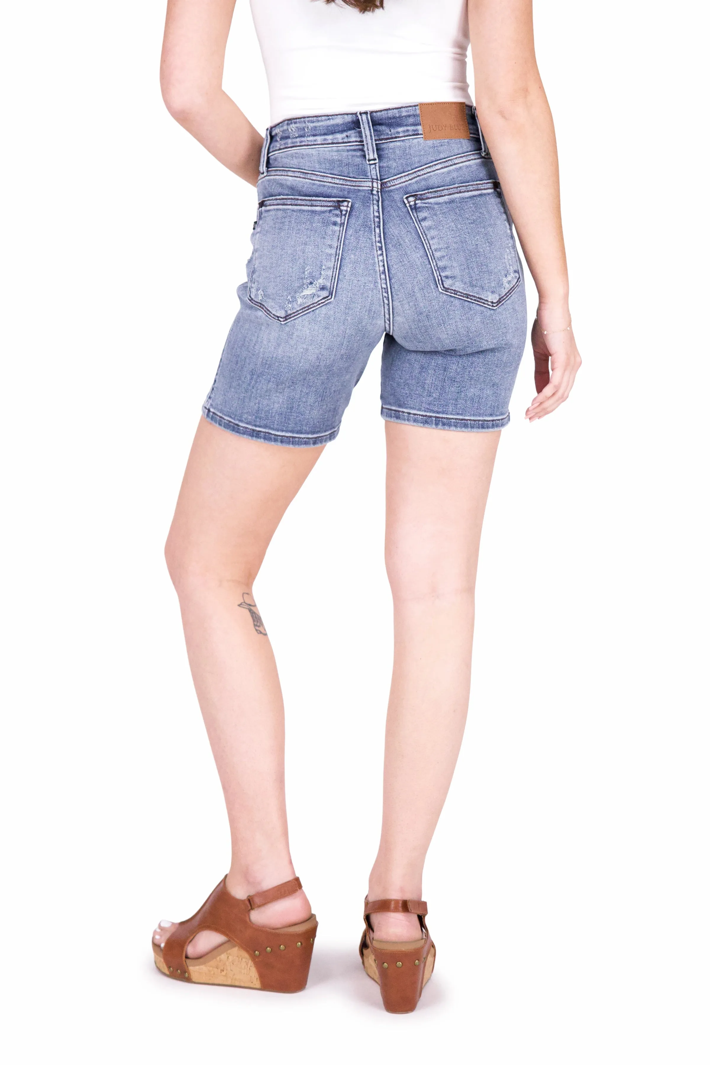 The Luna from Judy Blue: Mid-Rise Button Fly Destroyed Hem Denim Shorts